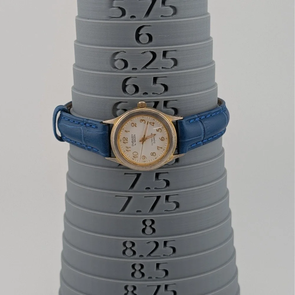 Embassy‎ by Gruen Ultra Thin Quartz Watch Gold Tone White Dial Blue Strap W1780